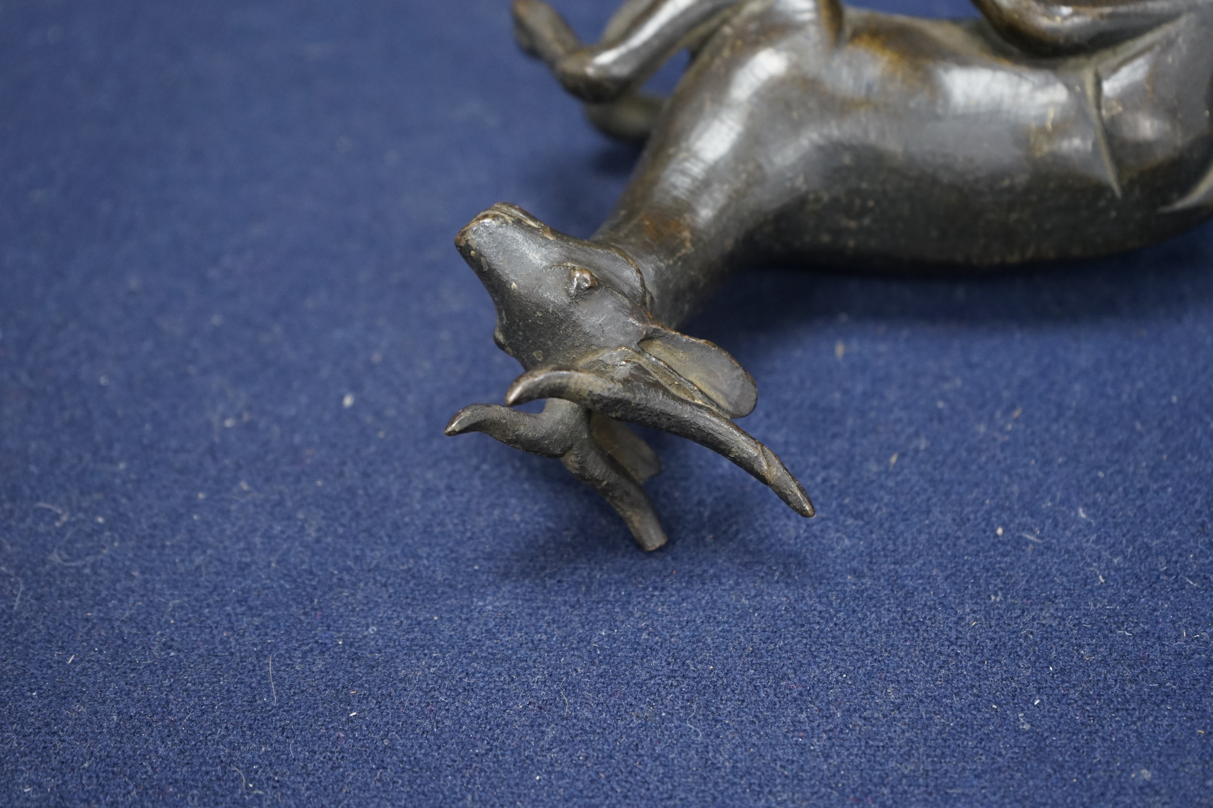 A Chinese early bronze figure of a deer, probably Yuan to Ming period, 13.5cm